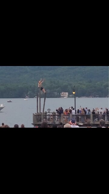 Guy caught jumping off wobbly pole into Lake George