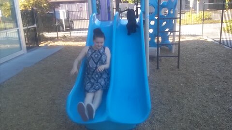 Puppy Loves to Play on the Slide