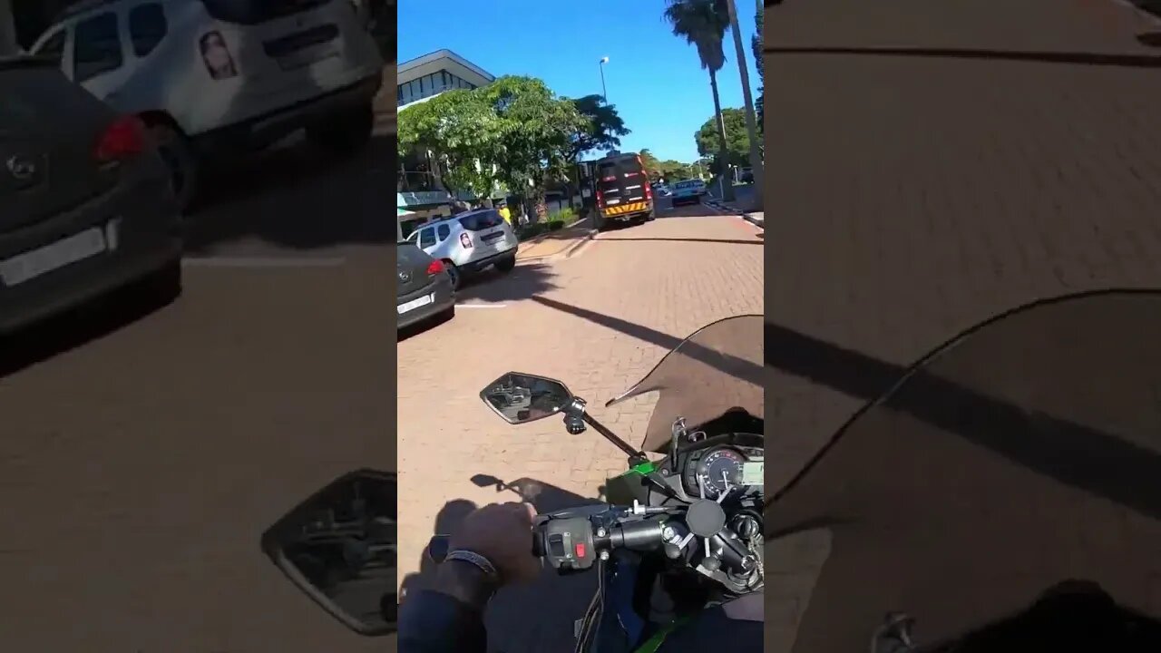 Umhlanga drive through at lunchtime #umhlanga #dogs #dogsofyoutube #bikerdog #short