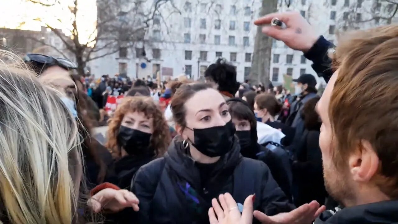 Freedom protesters vs left wing feminist protester #saraheverard