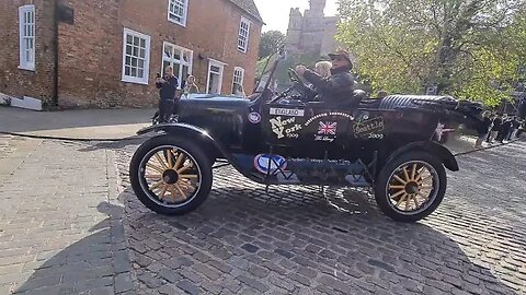 Lincoln Castle rally. Vehicles departing through the Castle gates.