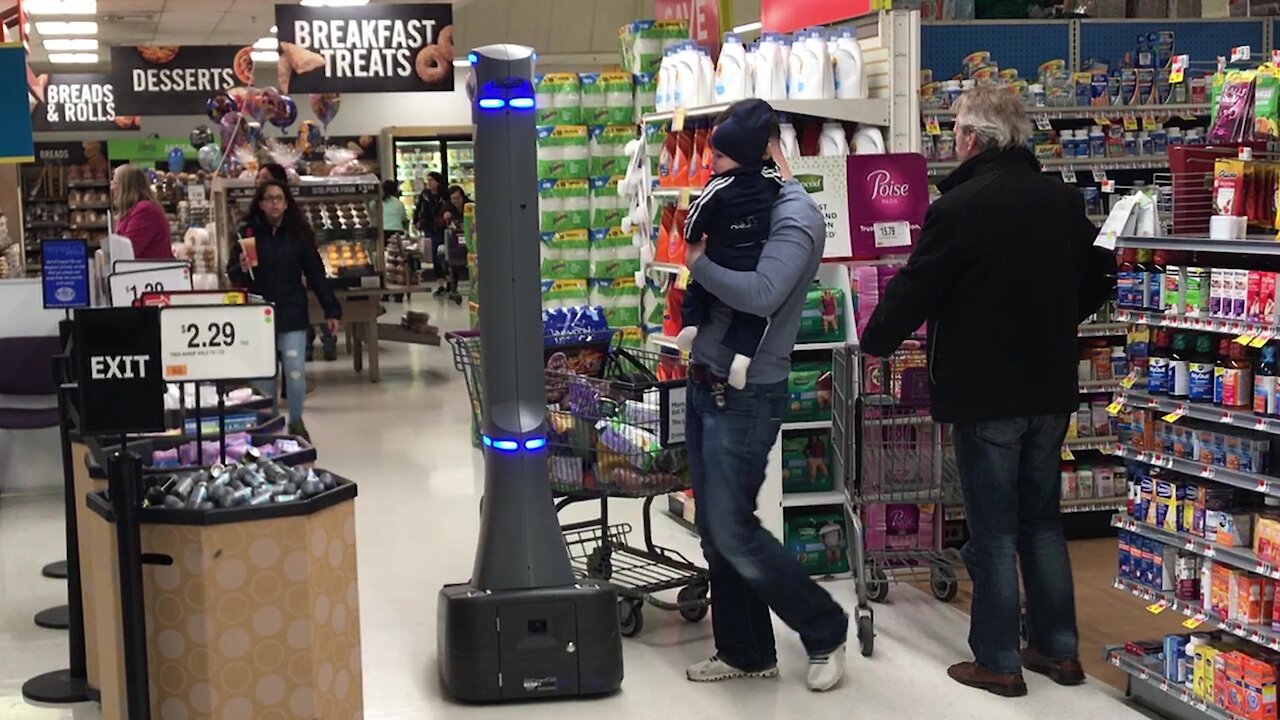 Customers suspicious of high tech security robot patrolling New York supermarket