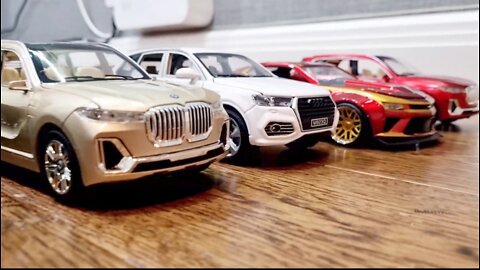 large size model cars being shown in dynamics on the floor