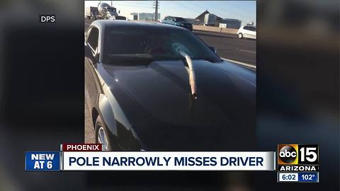 Pole narrowly misses driver on Loop 202