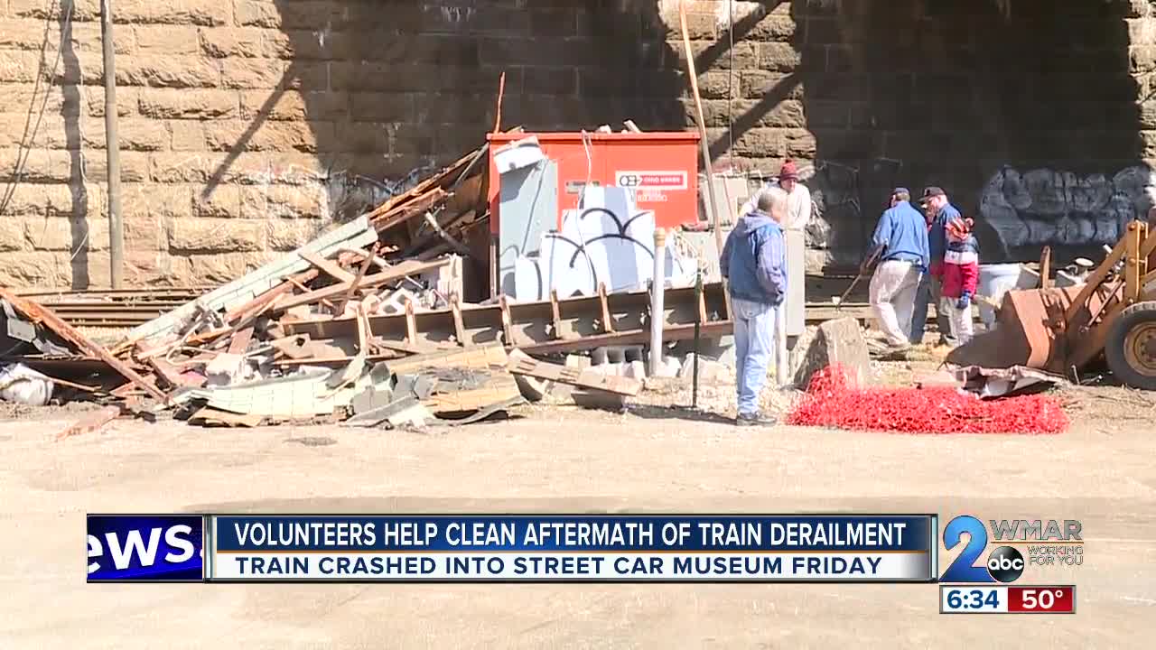 Volunteers Help Clean Aftermath of Train Derailment