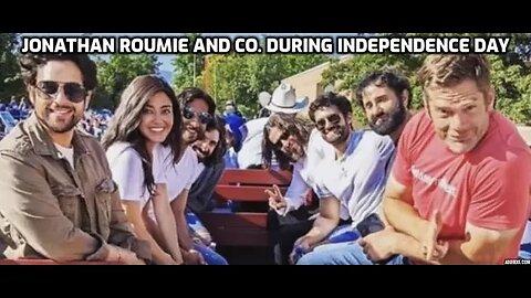 Jonathan Roumie takes a video from inside of the carriage during the celebration of Independence day