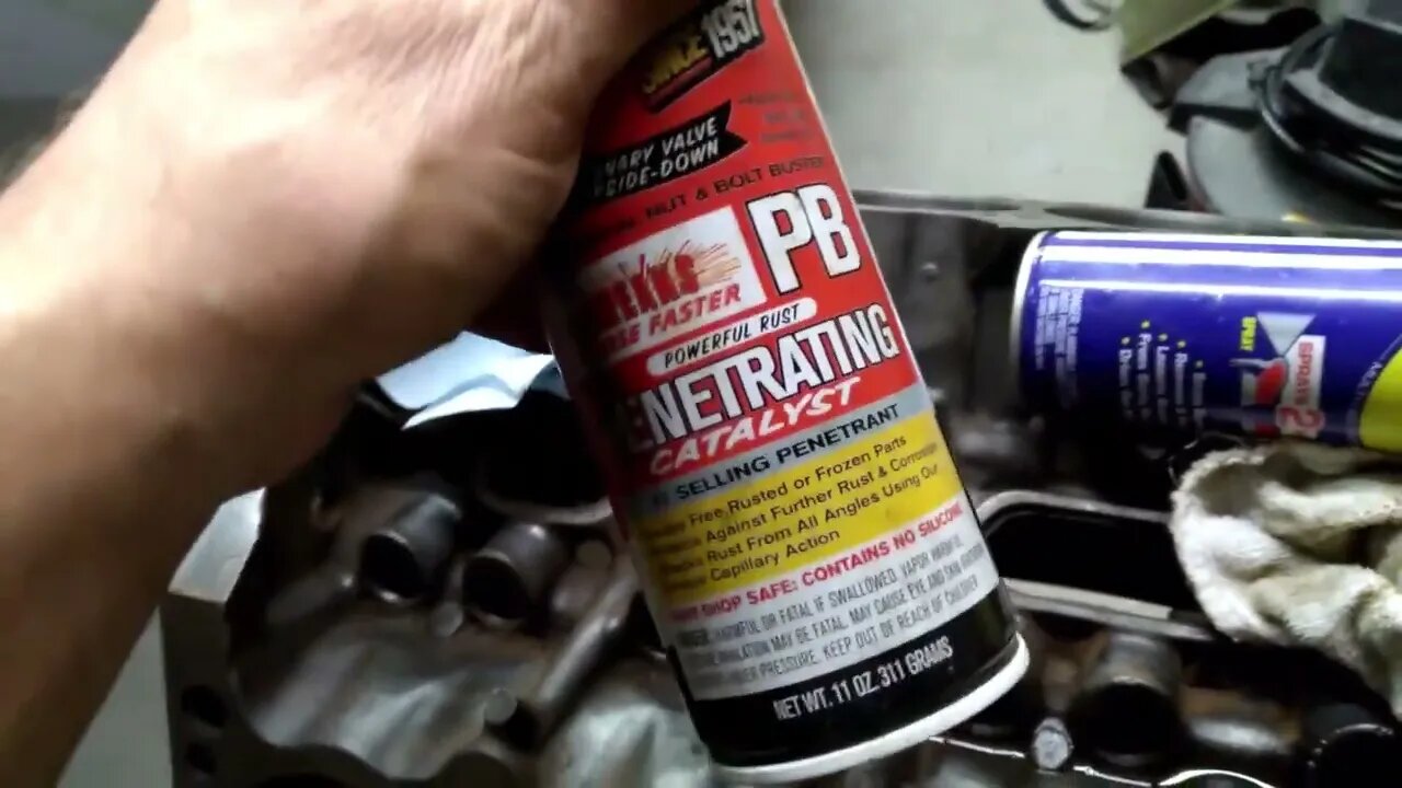 Cleaning 340 Mopar Lifter bores with a rust penetrating oil.