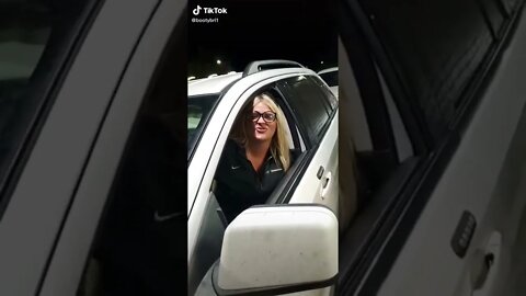 Old woman licks black ice cream cone at drive through lol.