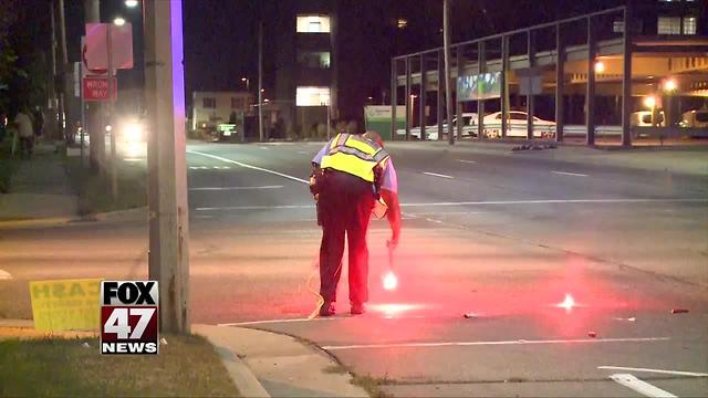 Lansing man in hospital after being hit by car late Sunday night