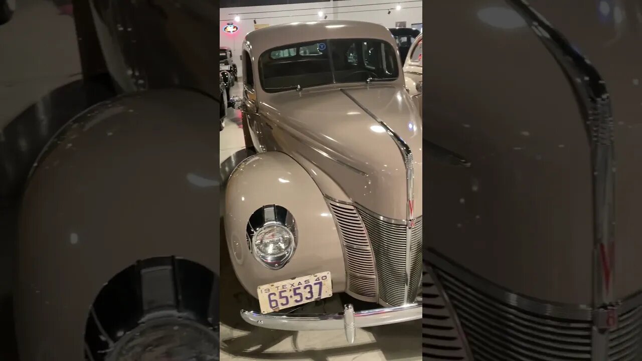 Row of 1940s Fords with woodie station wagon