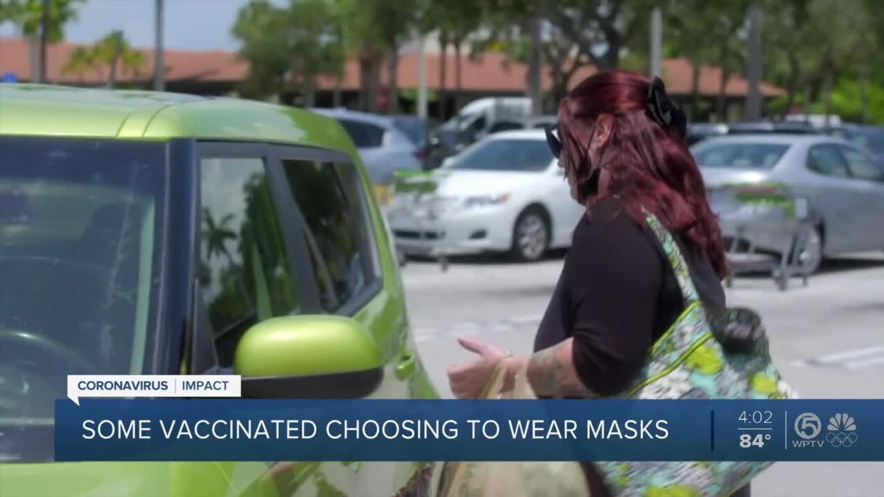 Should vaccinated people still wear face masks?