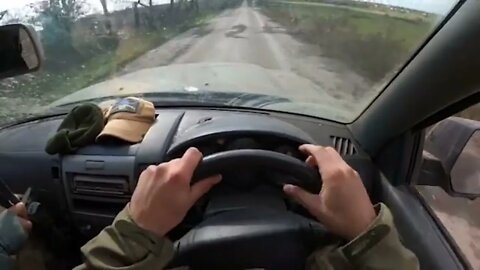 A Ukrainian soldier, who is driving, filmed on video how he was shot