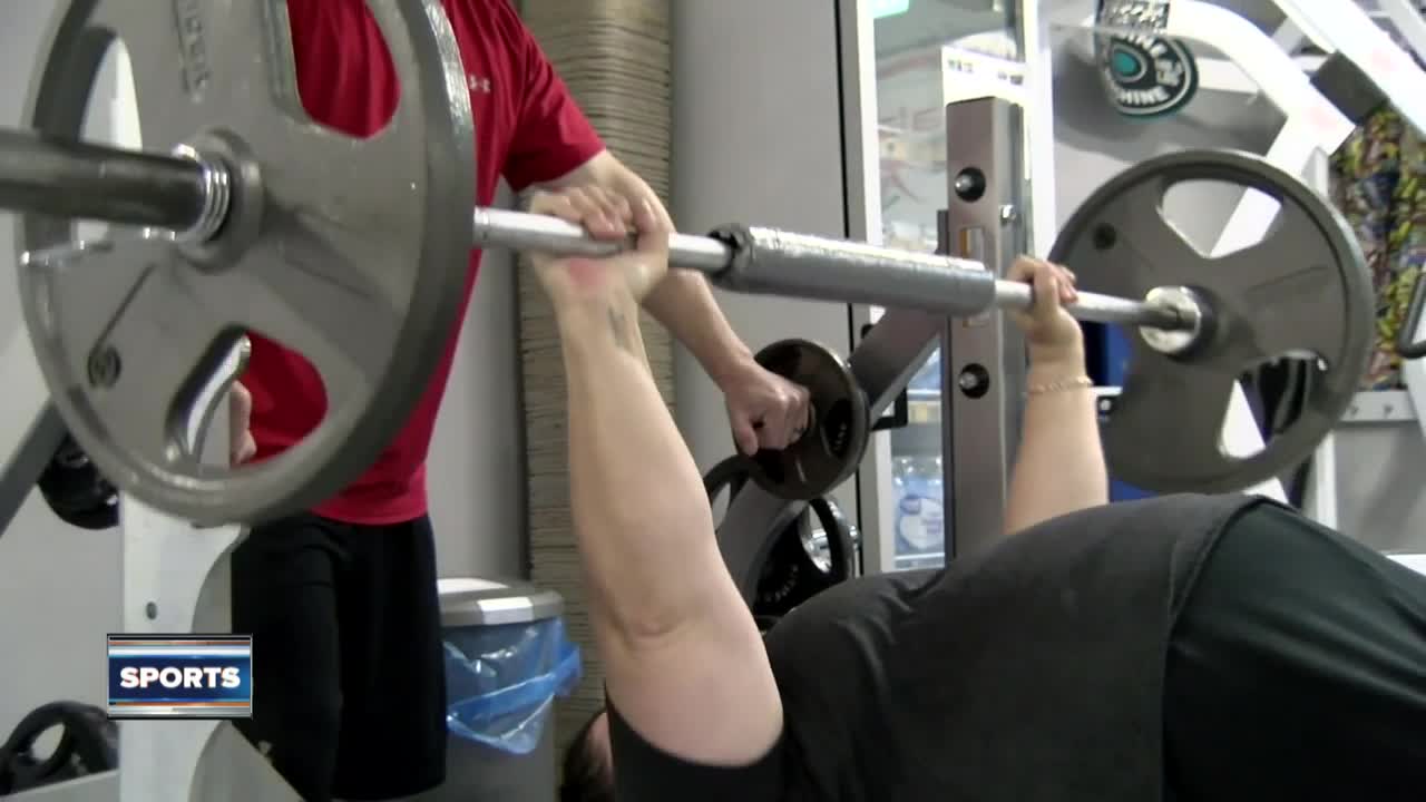 Racine native breaks world lifting record, brings home gold
