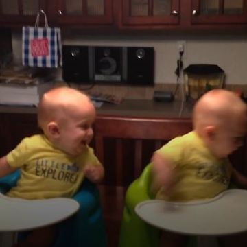 Twin Baby Boys Turning In Unison As Their Older Brother Runs Behind Them