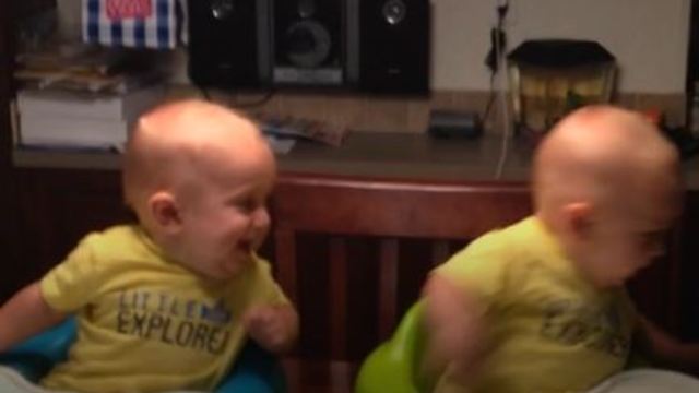 Twin Baby Boys Turning In Unison As Their Older Brother Runs Behind Them