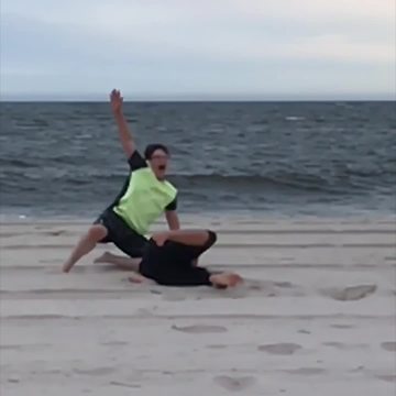 Mom And Son Running On The Beach, Failing Hilariously