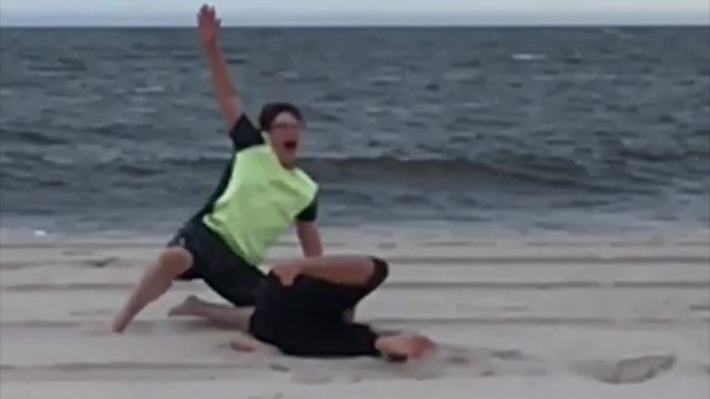 Mom And Son Running On The Beach, Failing Hilariously