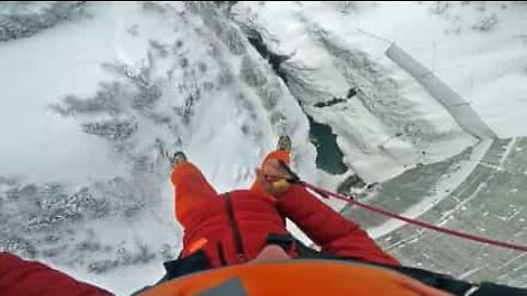 Incredible jump off a frozen dam in the French Alps