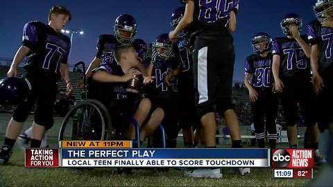 7th grader with neuromuscular disorder scores first touch down with help from teammates
