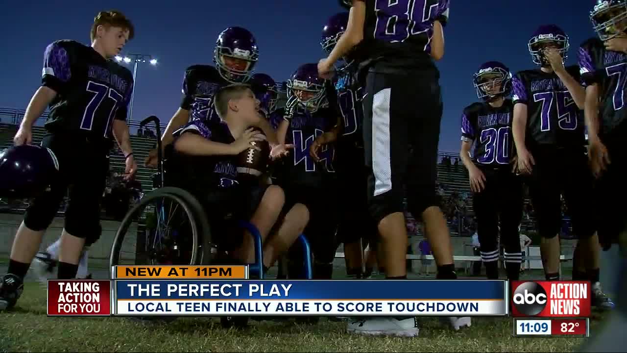 7th grader with neuromuscular disorder scores first touch down with help from teammates
