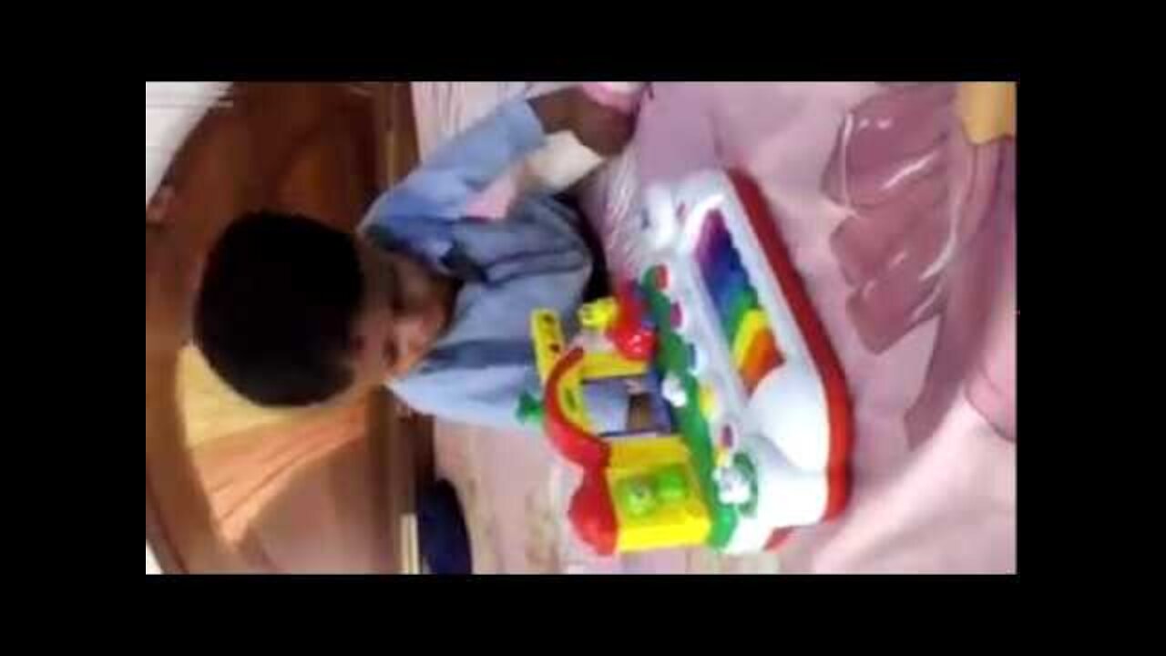 Funny baby playing video