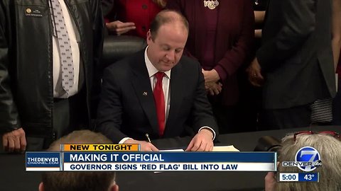 'Let's start saving some lives': Colorado governor signs 'red flag' gun, mental health measure