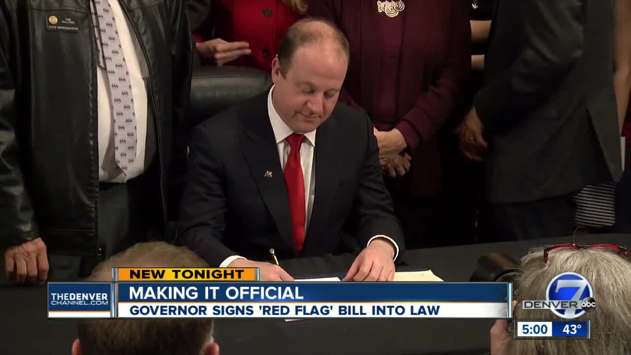 'Let's start saving some lives': Colorado governor signs 'red flag' gun, mental health measure