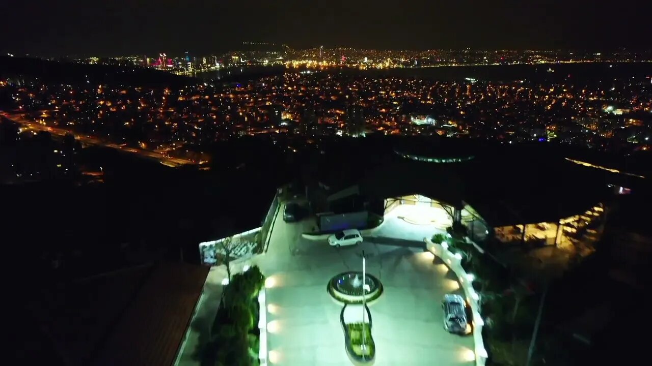 Night View from Drone on Holiday Resort and Big City