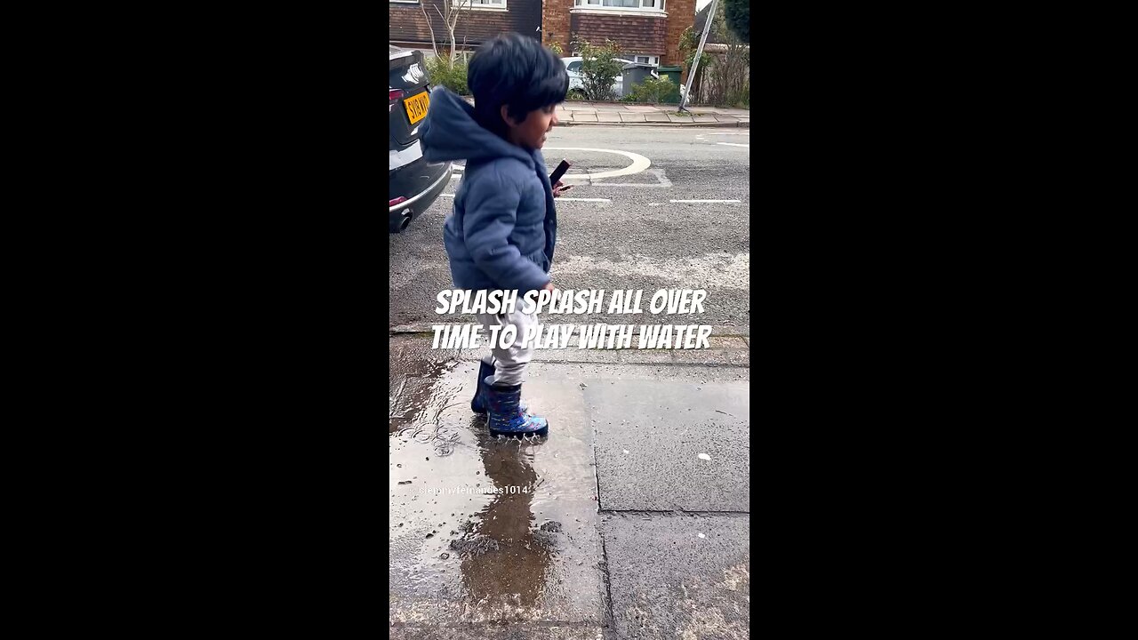 Kid playing in little water pool