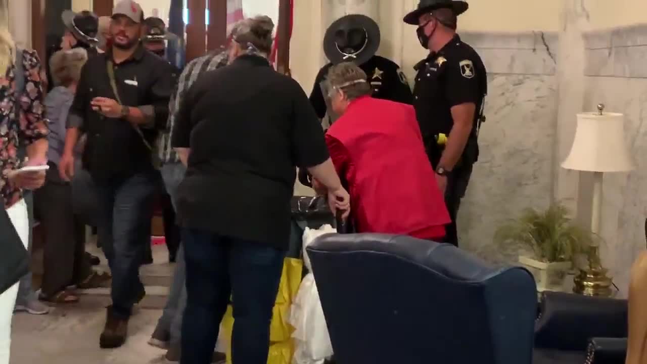 Glass shattered at Statehouse after protesters banged on the doors