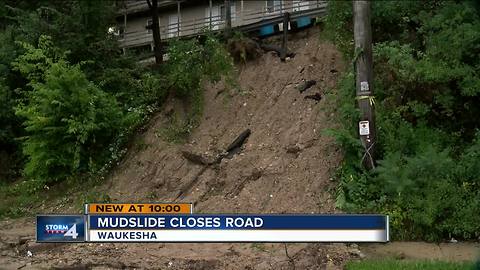 Slope washes away into Waukesha road after Wednesday rain