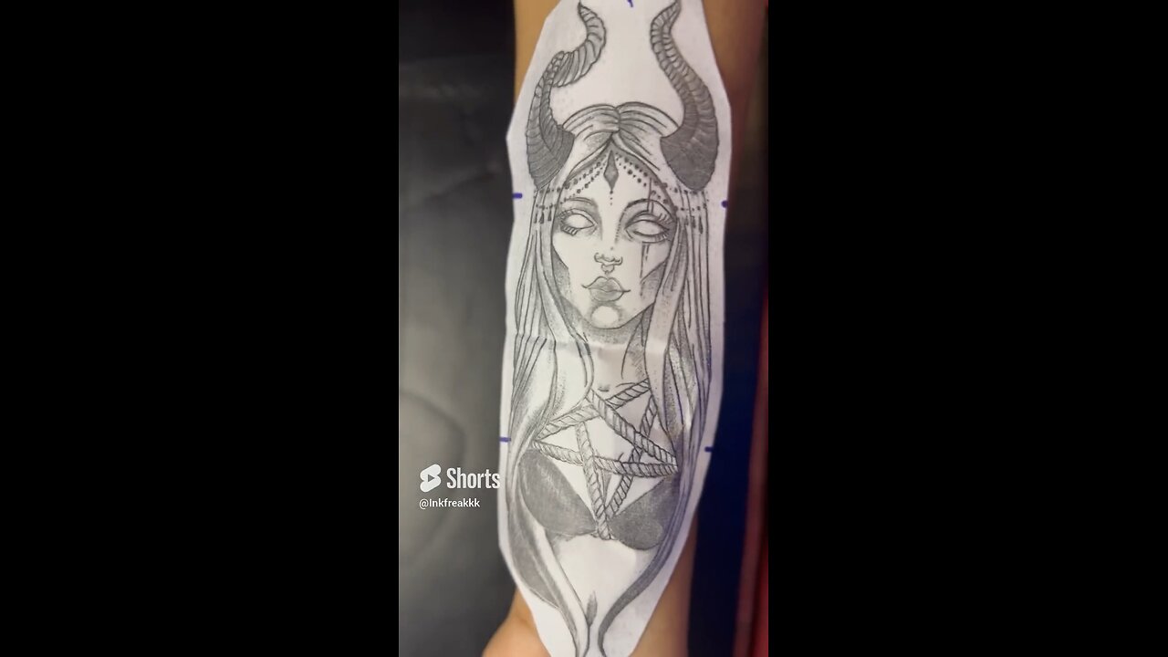 Scar cover up tattoo of demon girl