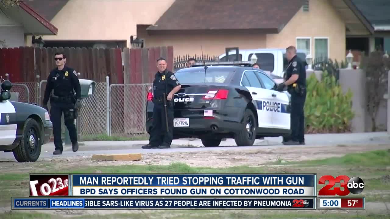 Man trying to stop traffic with gun