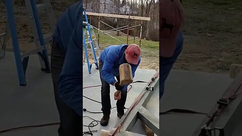 timber framing hammering in wood pins