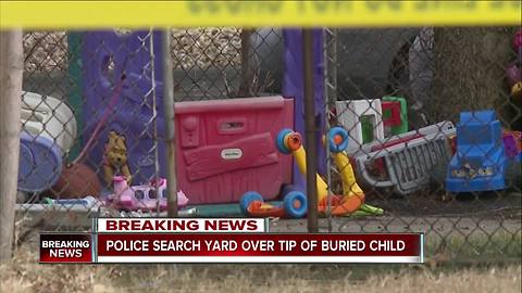 Police search yard over tip of buried child