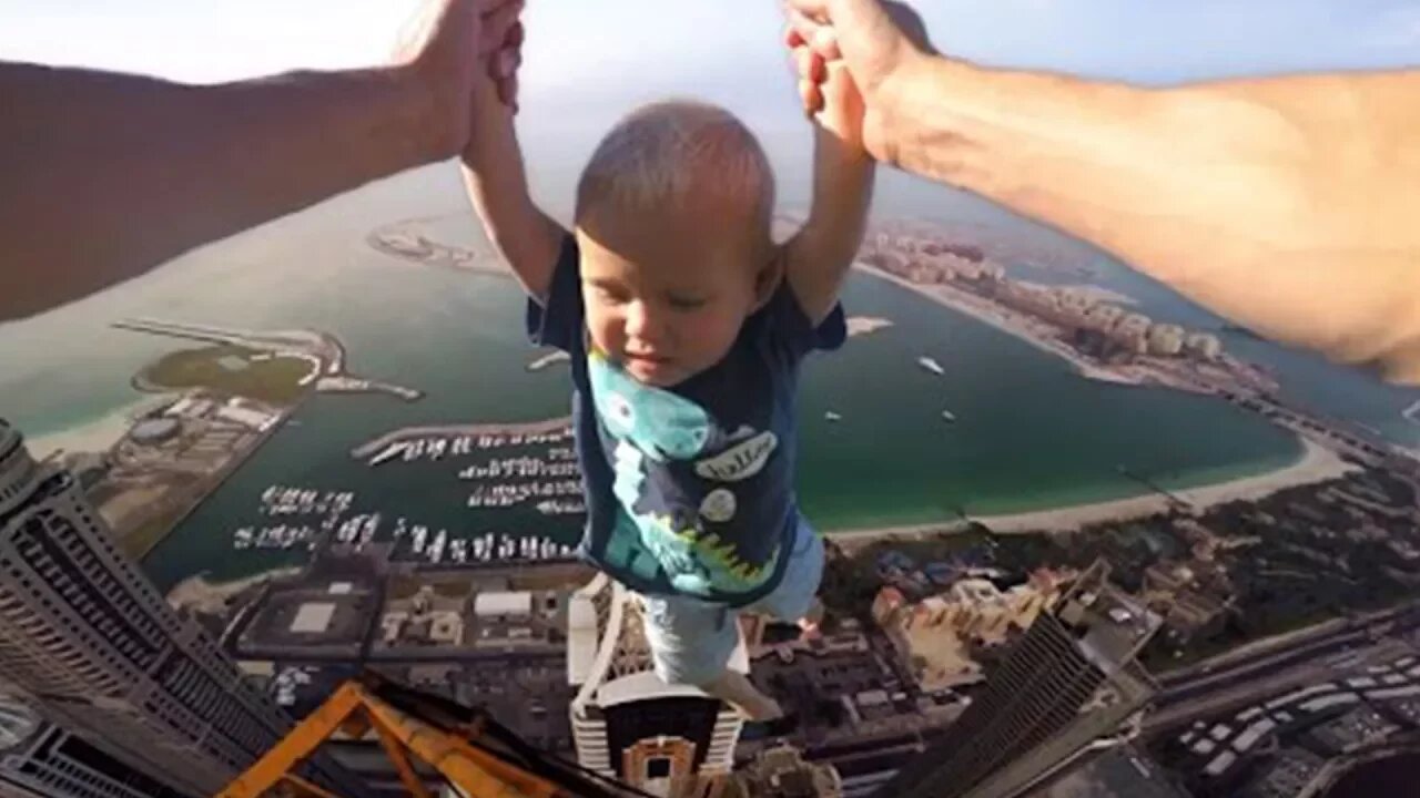 kid almost falls off building doing floor is lava challenge