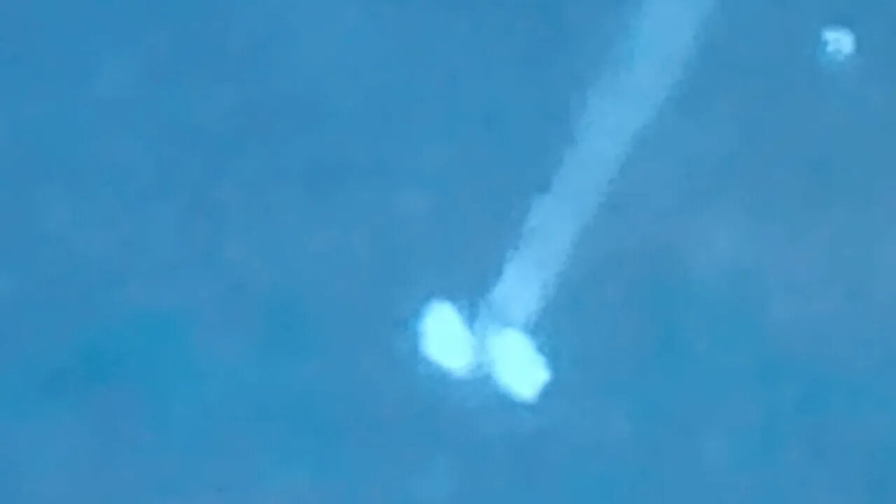 Sphere UFO flies in front of jet