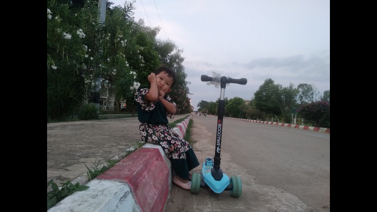 Cute Baby with scooter ! Then she made a post to shoot photo