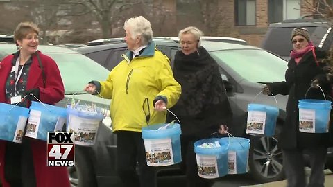 Group delivers buckets of toothbrushes to Sen. Stabenow