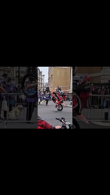 motor bike does a wheelie out side Horse Guards parade #horseguardsparade