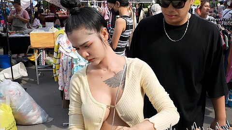 Pretty girl eating snacks in Thailand