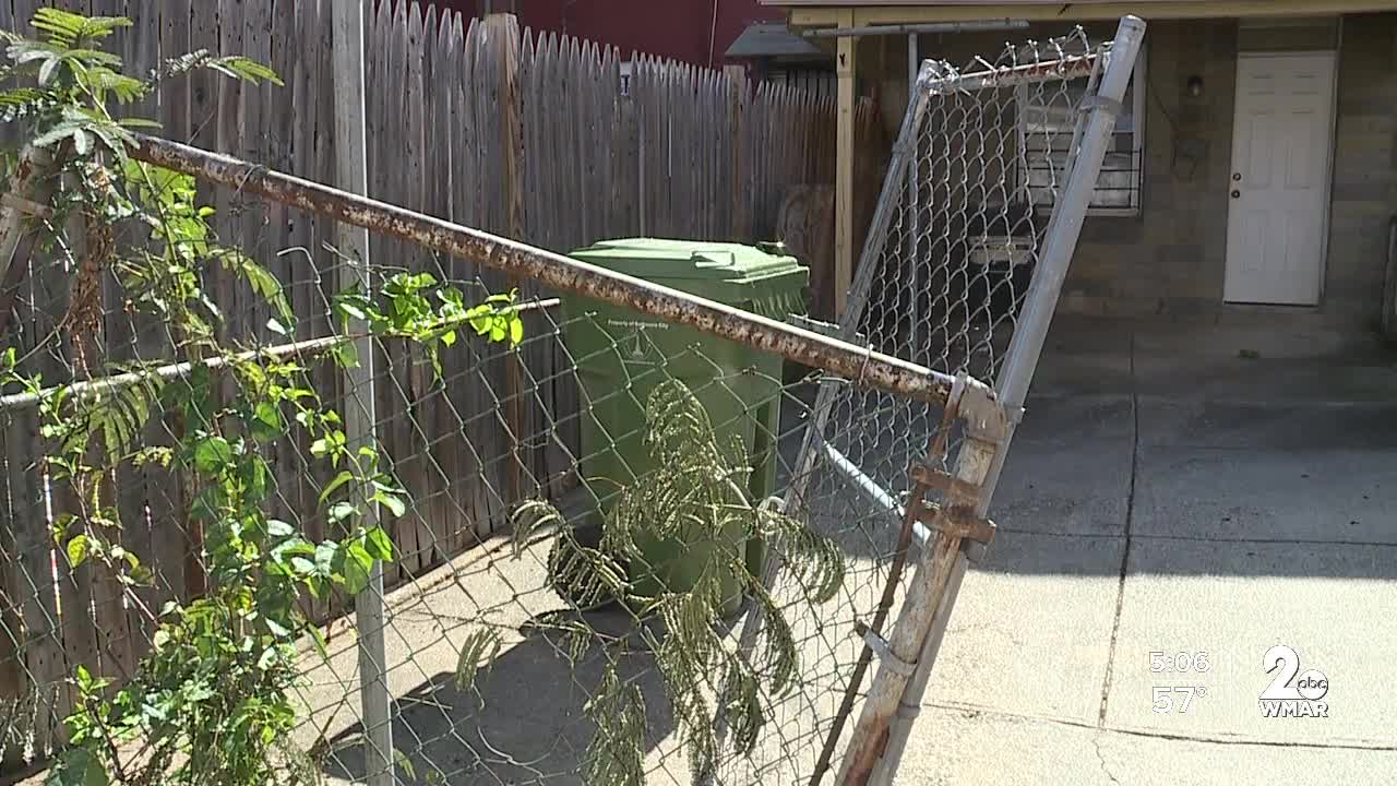 Woman says Baltimore City sanitation truck demolished her fence