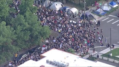 Hundreds take a knee for George Floyd in Denver