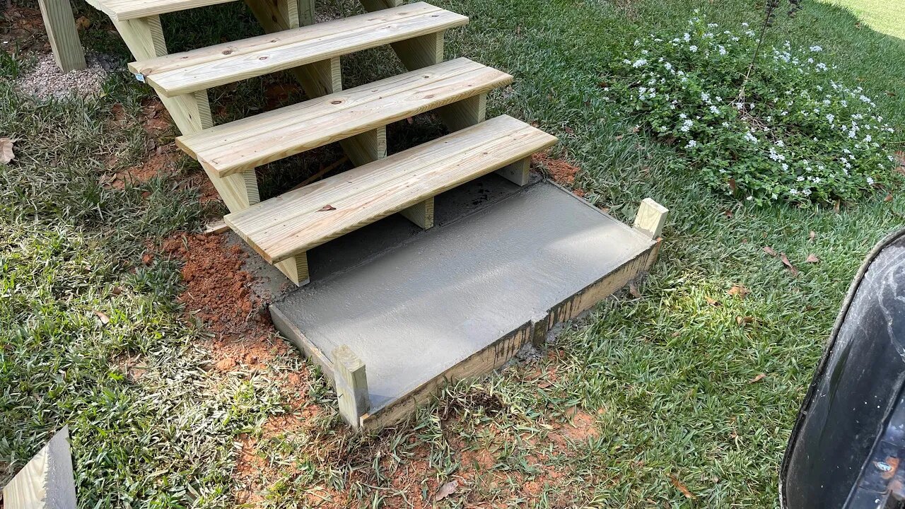 Poured a concrete pad in front of my stairs