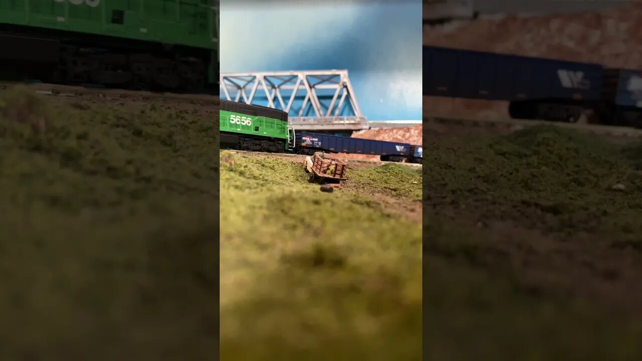 N Scale U28C passing a rural crossing