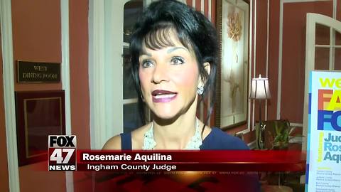 Judge Aquilina speaking in Lansing on Tuesday