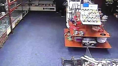 VIDEO: Man crashes car through store, tries to steal cell phones