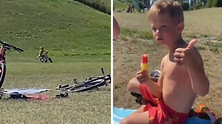 Fearless kid rides bike down hill, totally wipes out