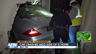 Brand new car smashes into Bay Ho home