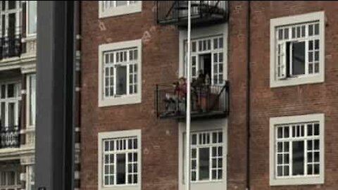 Man plays trumpet for neighbors during quarantine